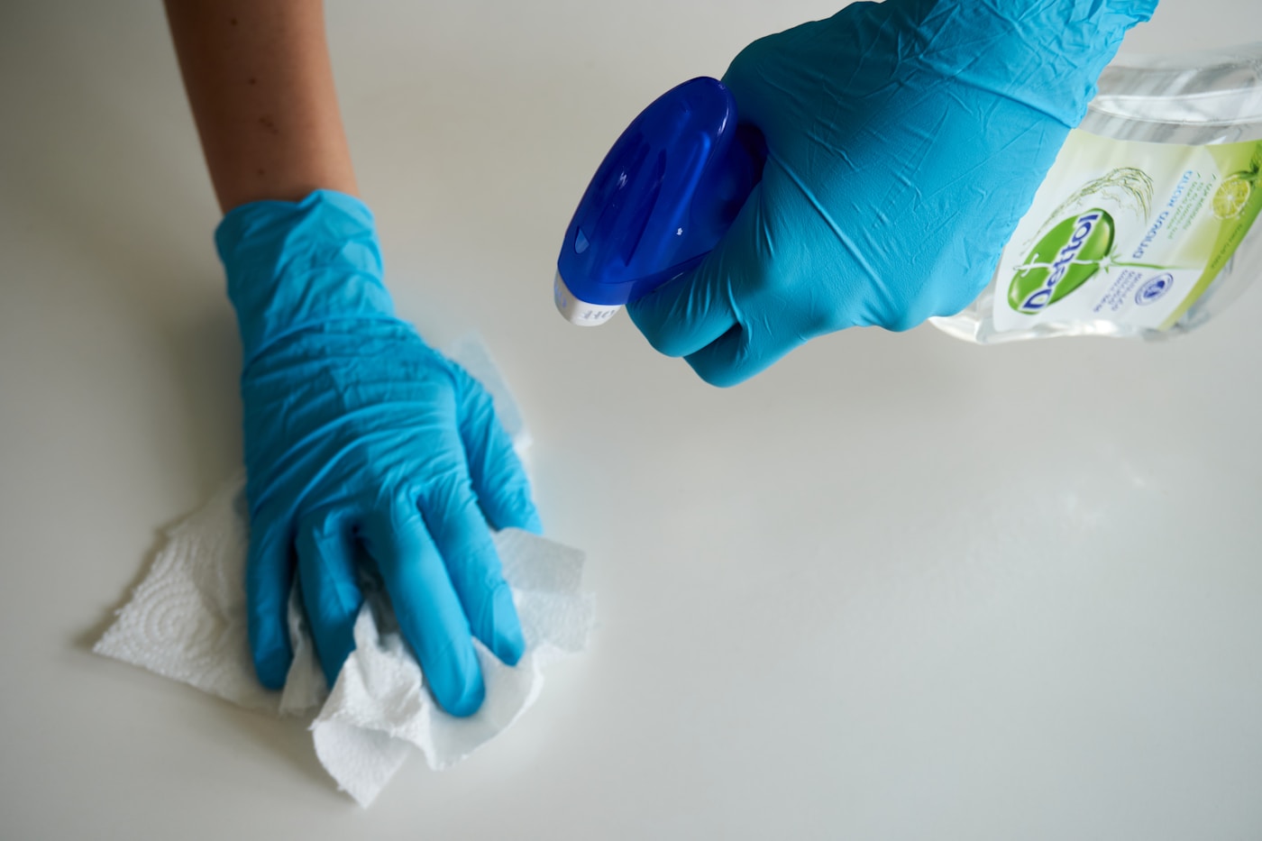 Cleaner wiping a surface carefully